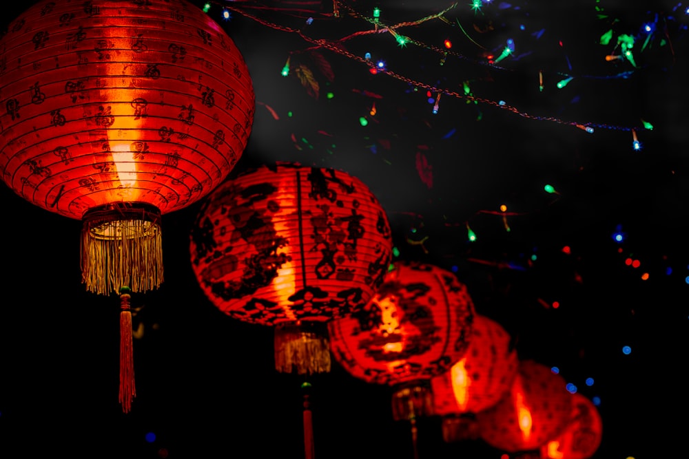 chinese lanterns lit up in the night sky