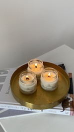 A serene workspace with spiritual books and candles symbolizing trust and healing.