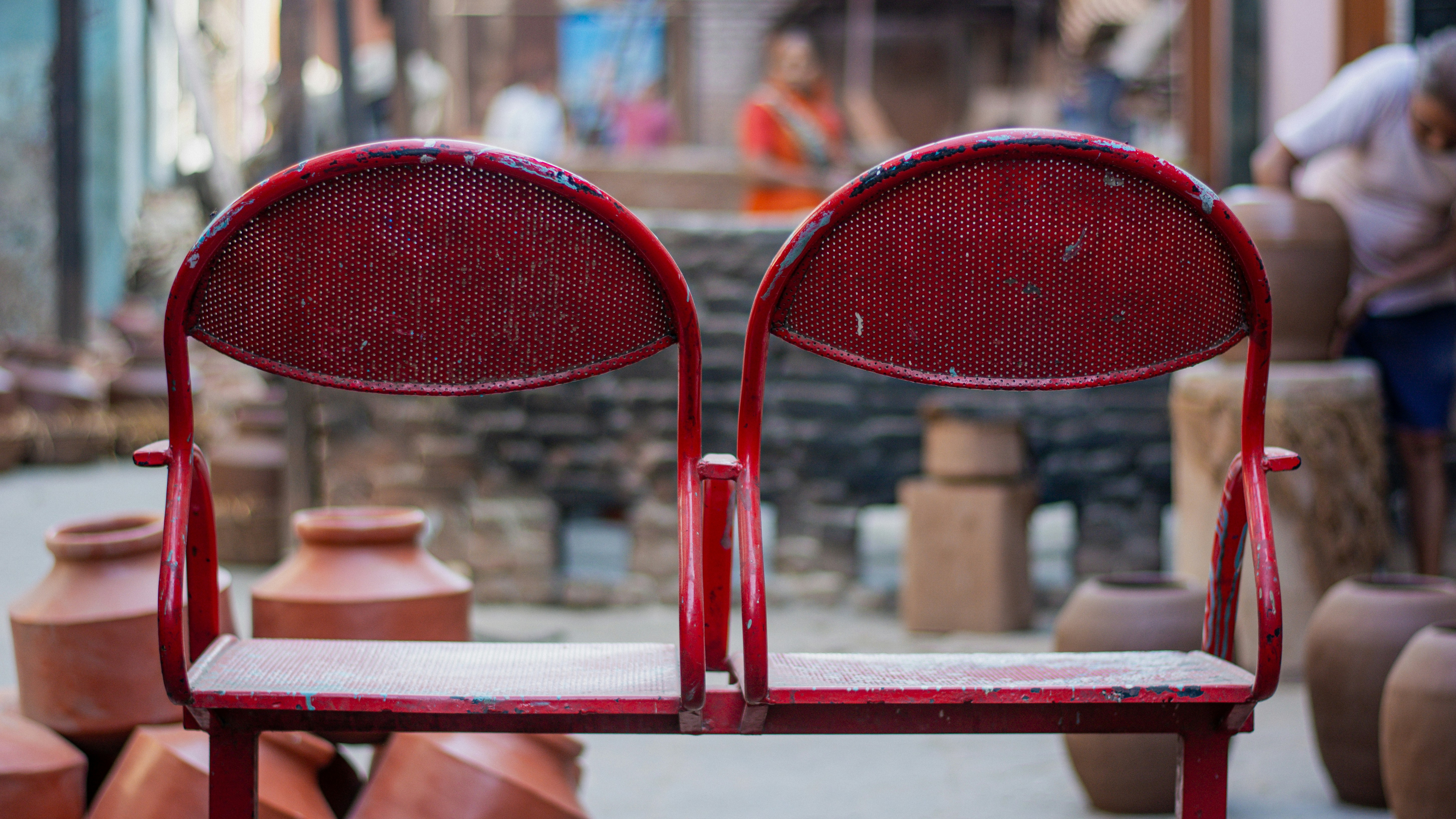 a couple of red chairs sitting next to each other