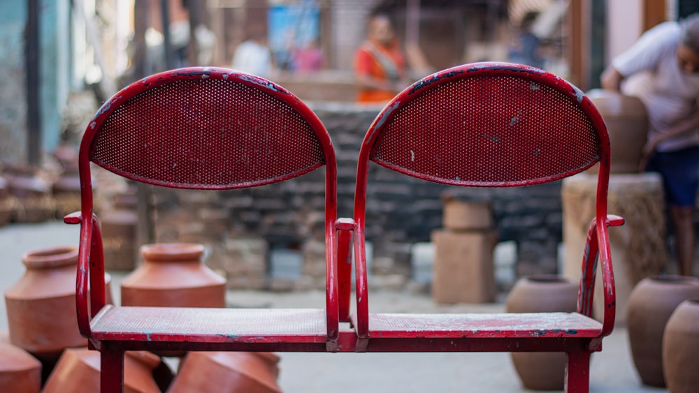 a couple of red chairs sitting next to each other