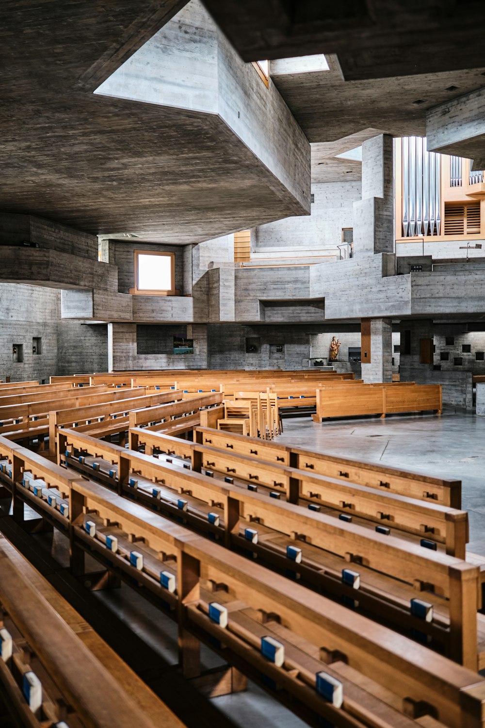 an empty church with wooden pews and pews