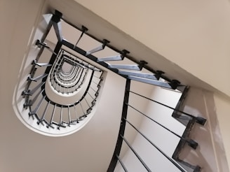 a spiral staircase in a house with a skylight