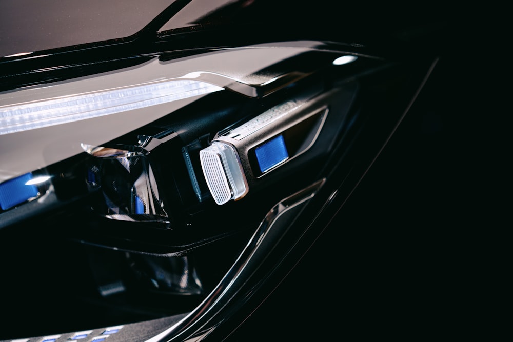 a close up of a car door handle with a light on