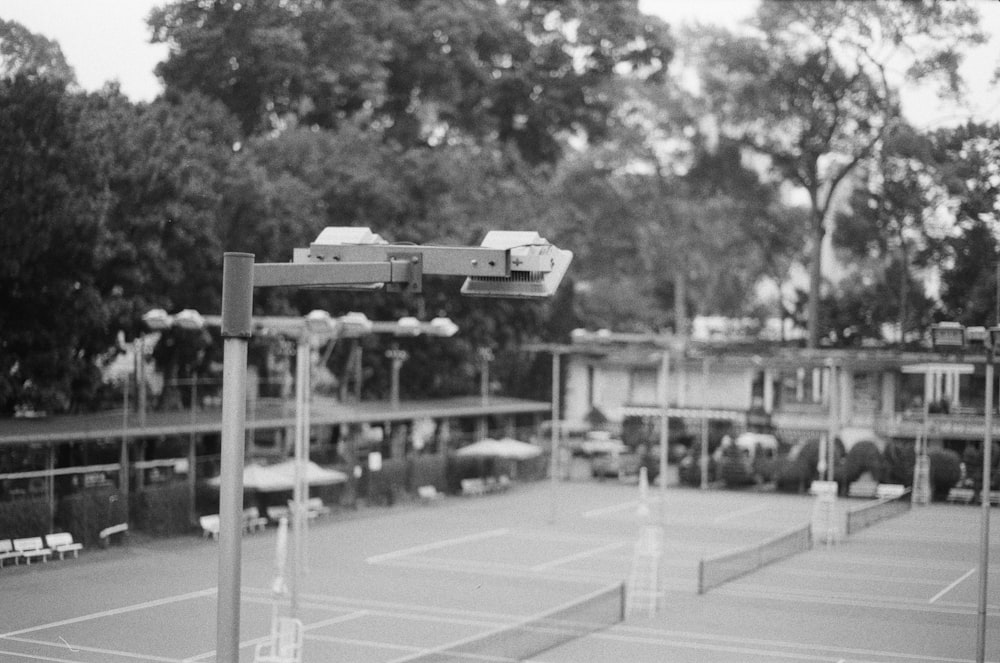 a black and white photo of a tennis court