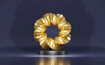 a golden object on a black stand on a blue background
