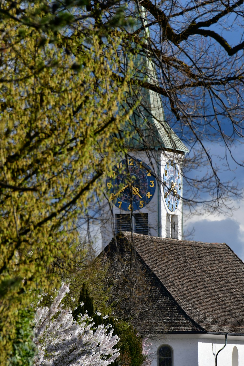 a church with a steeple and a clock on it