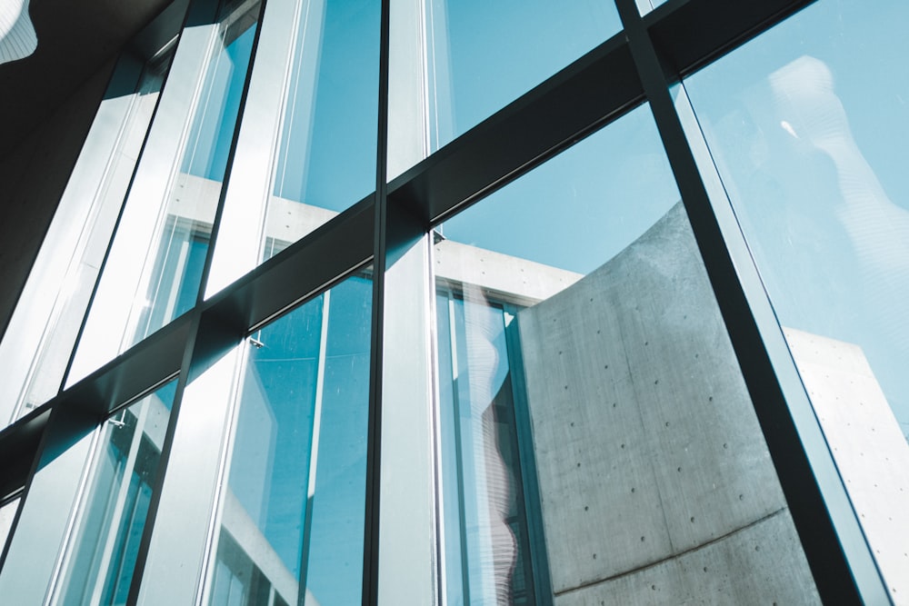 a large glass window with a building in the background