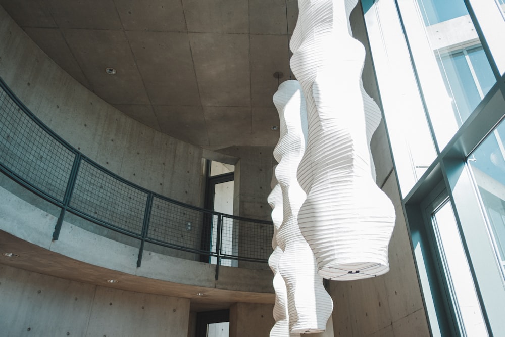 a spiral staircase inside of a building next to a window