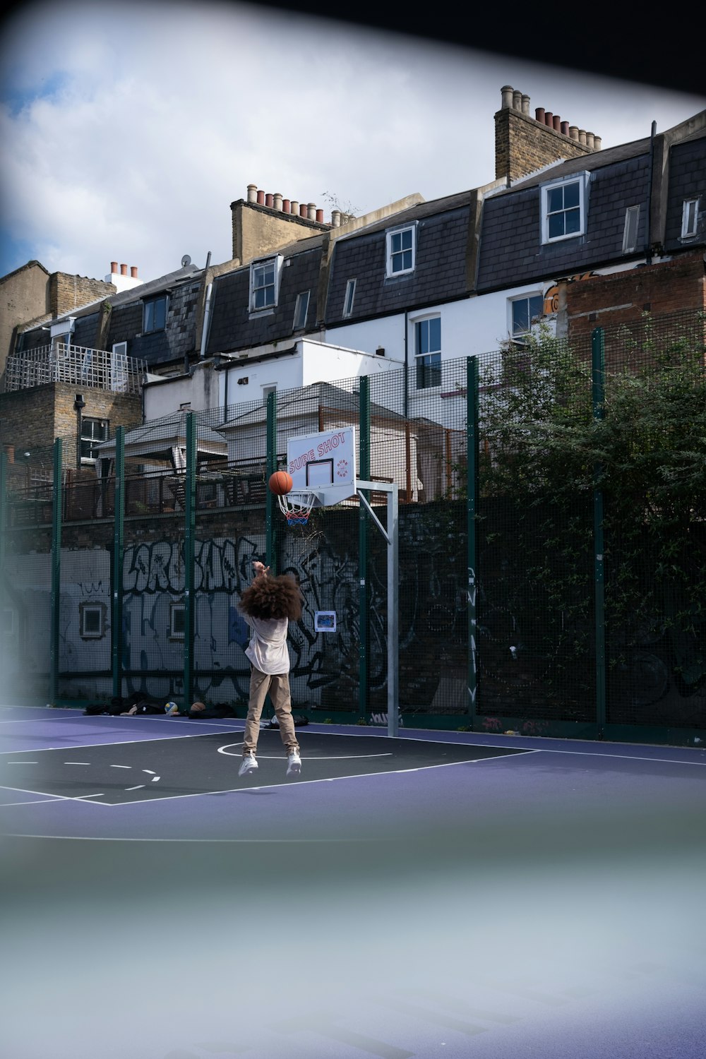 a person on a court with a basketball