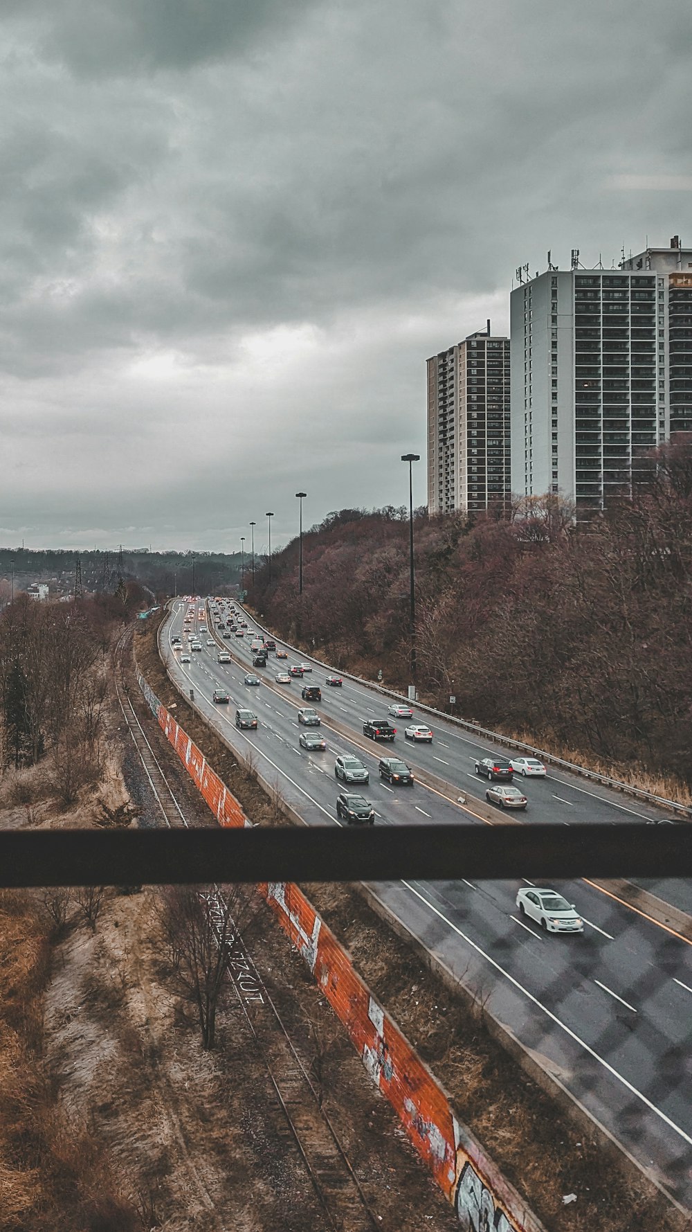 a highway with a bunch of cars driving down it