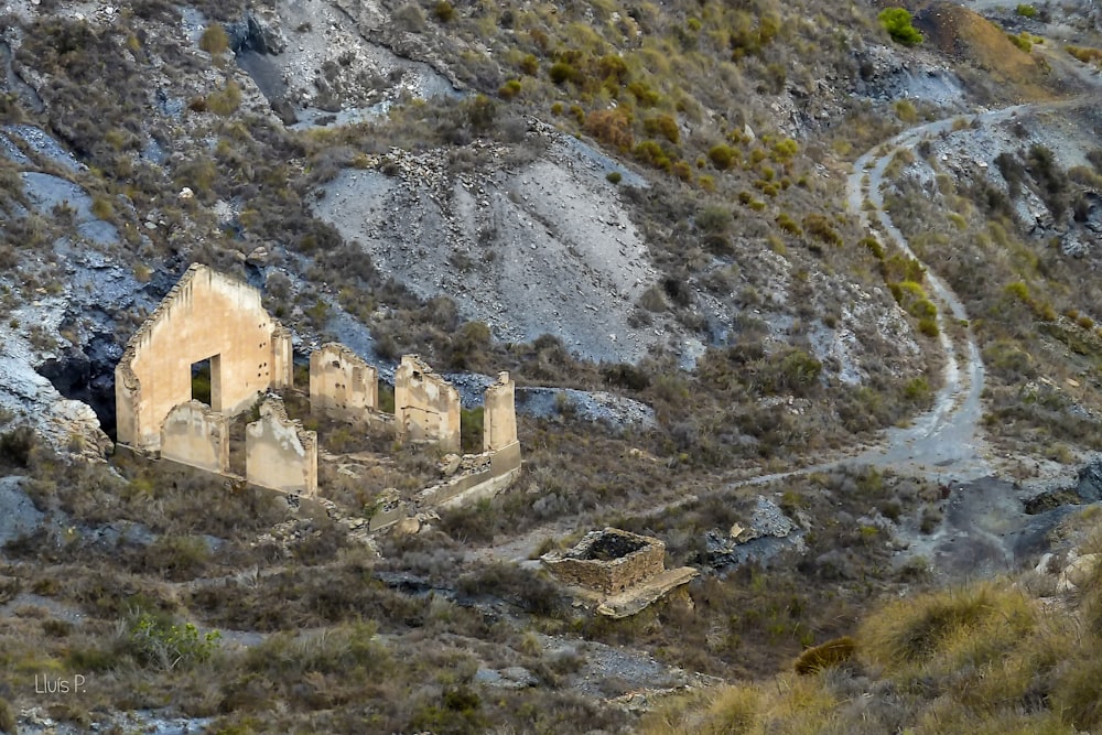 a very old building sitting on the side of a mountain