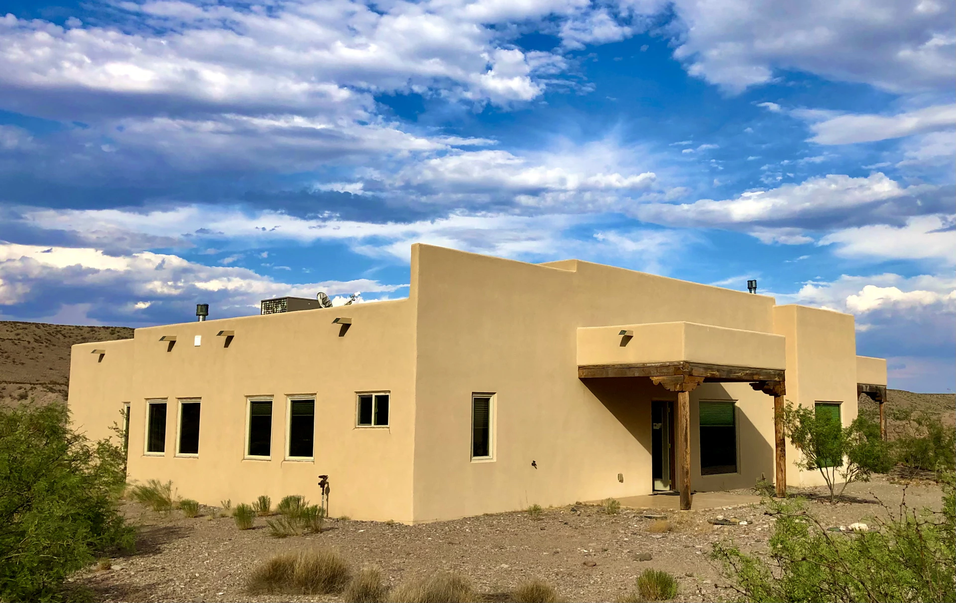 a tan building with a blue sky in the background