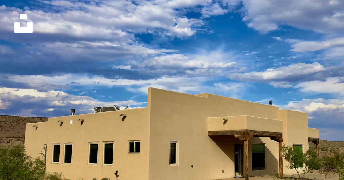 Tan Building A tan building with a blue sky in the background photo – Free New ...