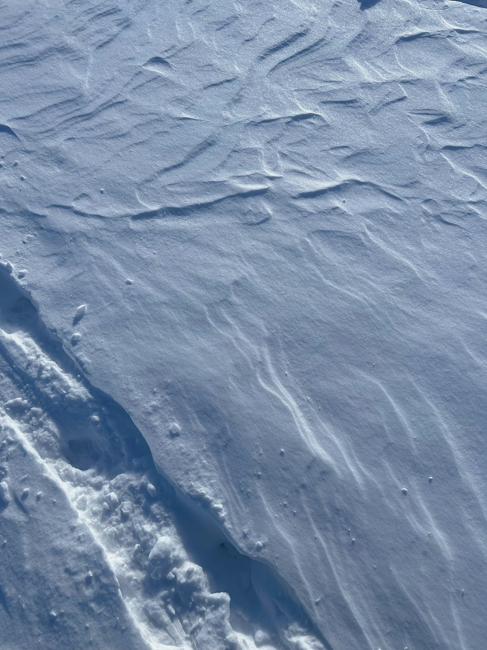 a person skiing down a snow covered slope