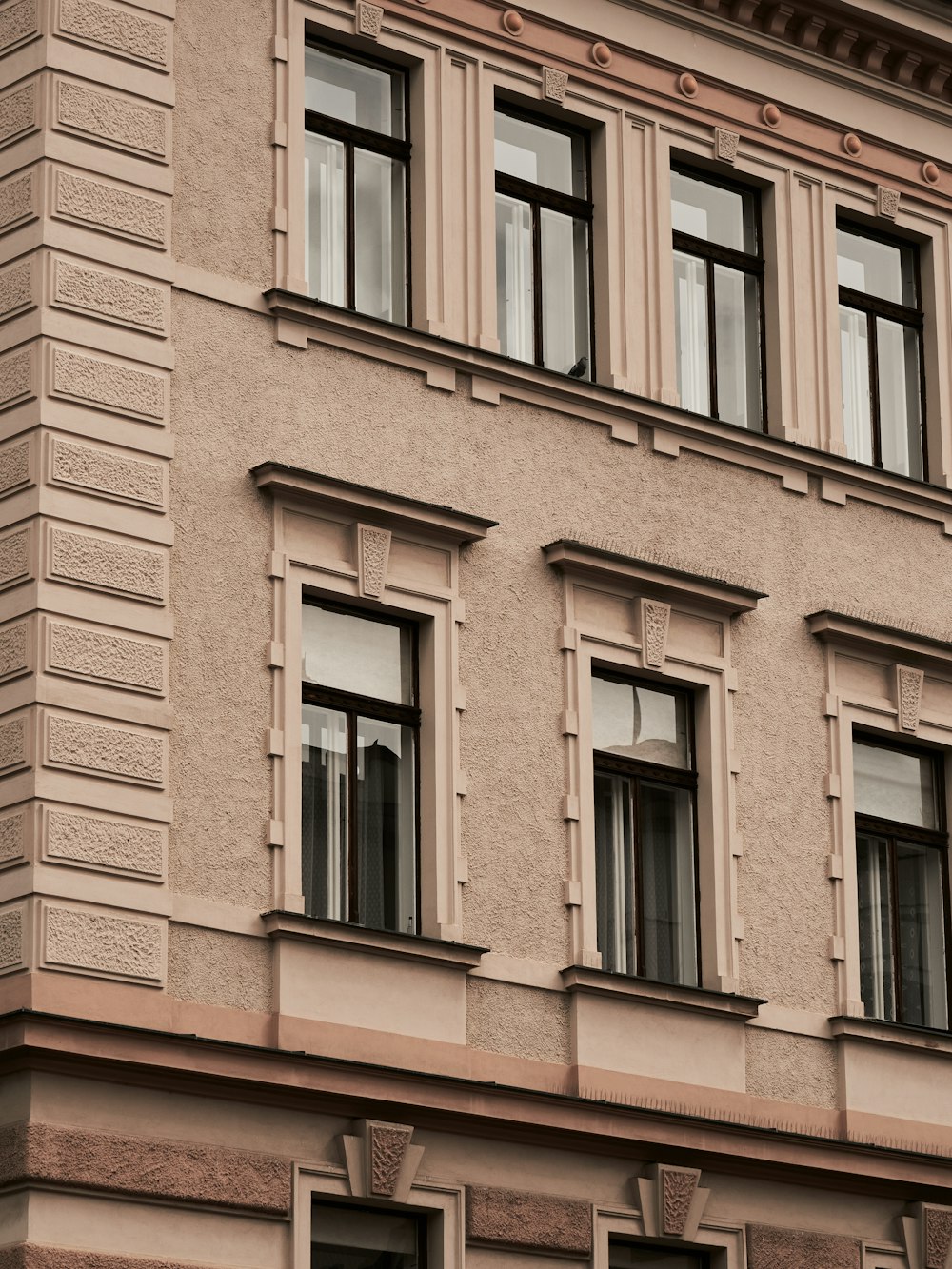 a building with windows and a clock on the front of it