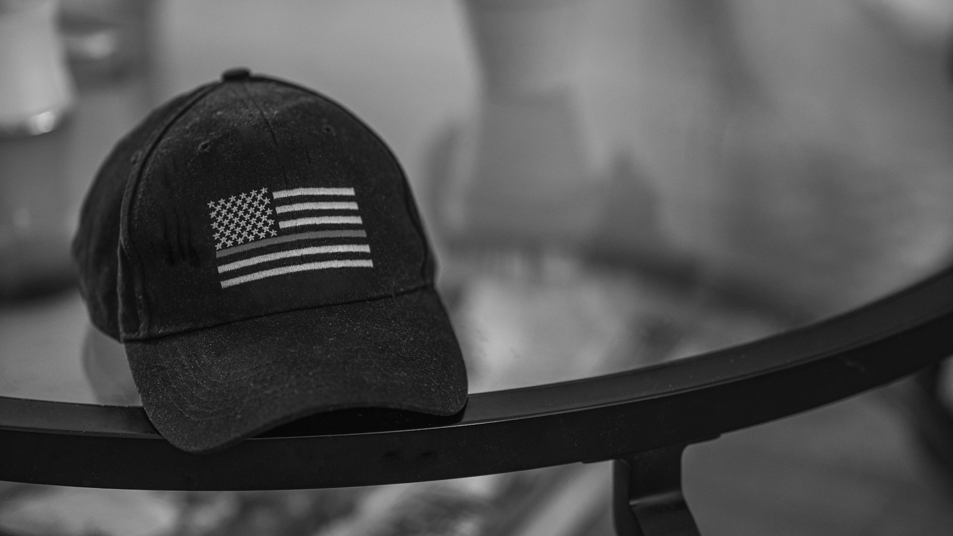 a black and white photo of a hat on a table