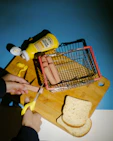 a person cutting bread with a pair of scissors