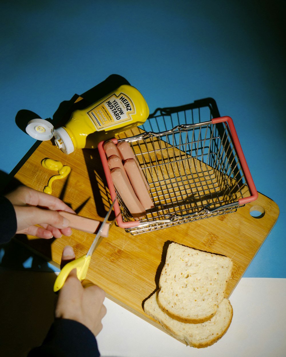 a person cutting bread with a pair of scissors