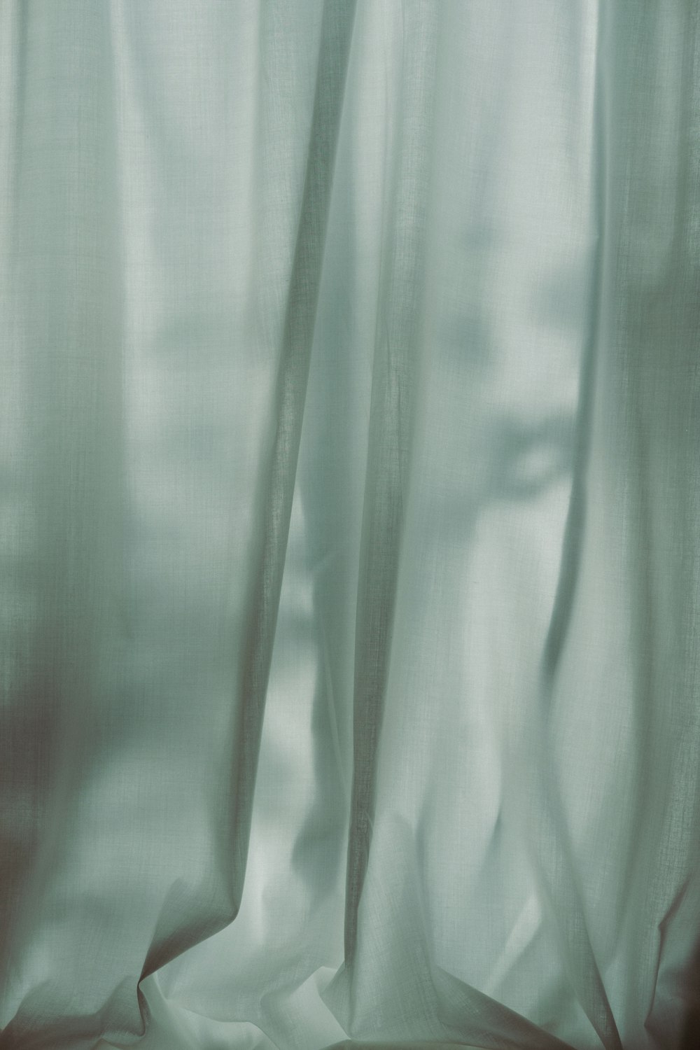 a close up of a curtain with a blurry background