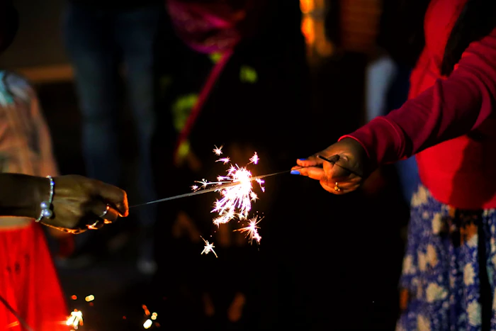 Family members holding sparklers together
