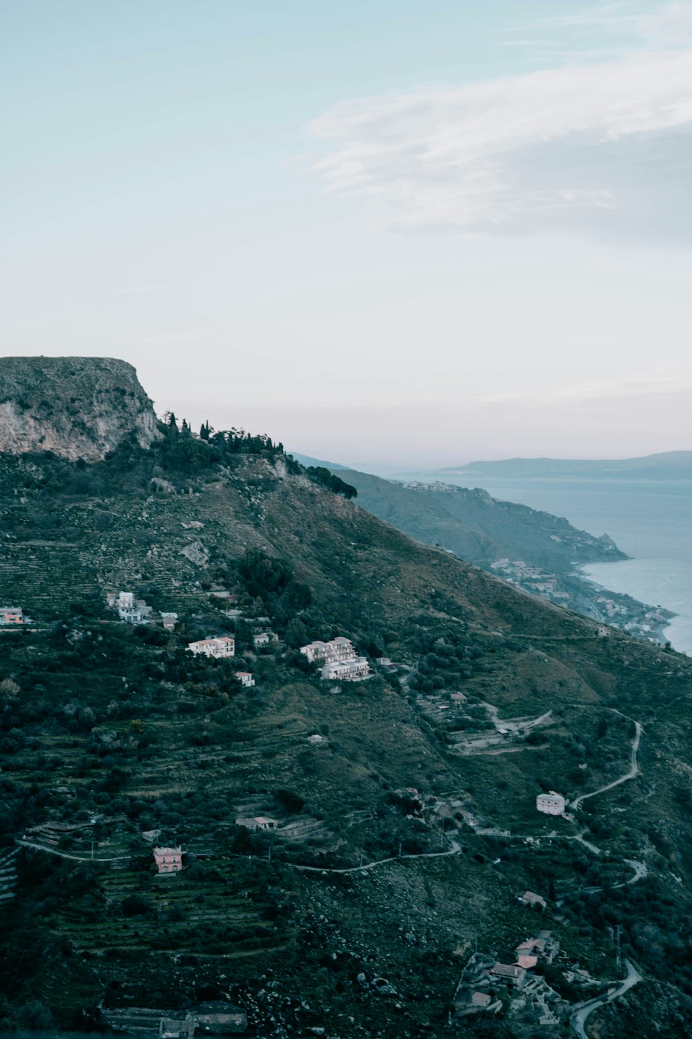 a hill that has some houses on top of it