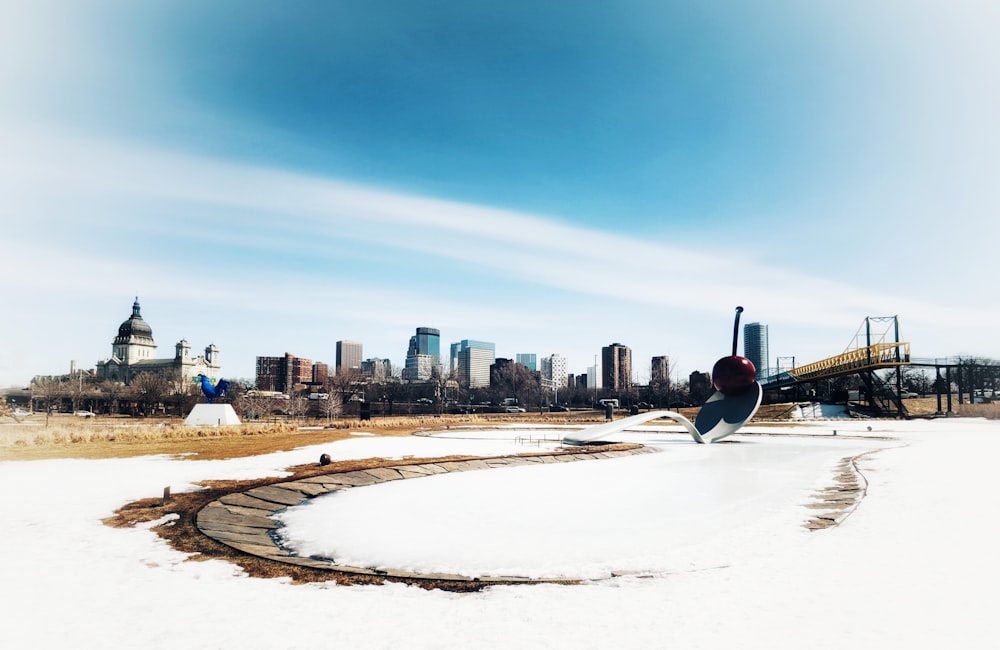 a man riding a snowboard down a snow covered slope