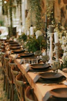 a long table with plates and place settings