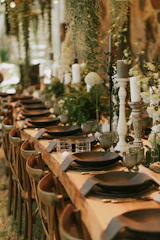 a long table with plates and place settings