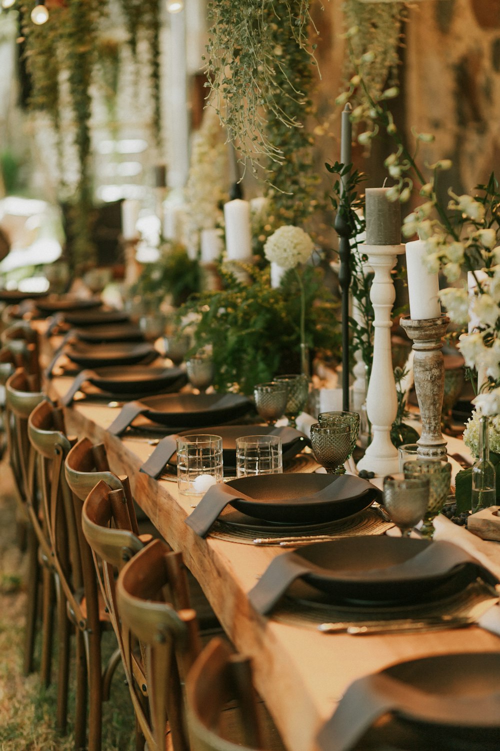 a long table with plates and place settings