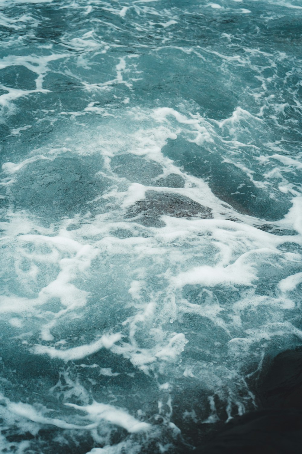 a large body of water with waves coming in