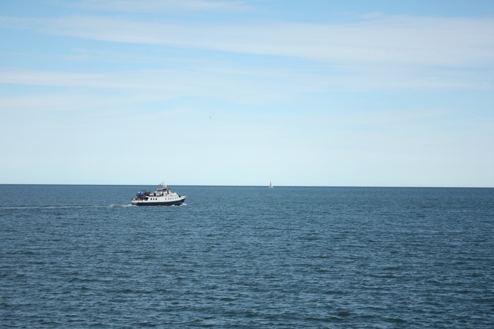 a boat in the middle of a large body of water