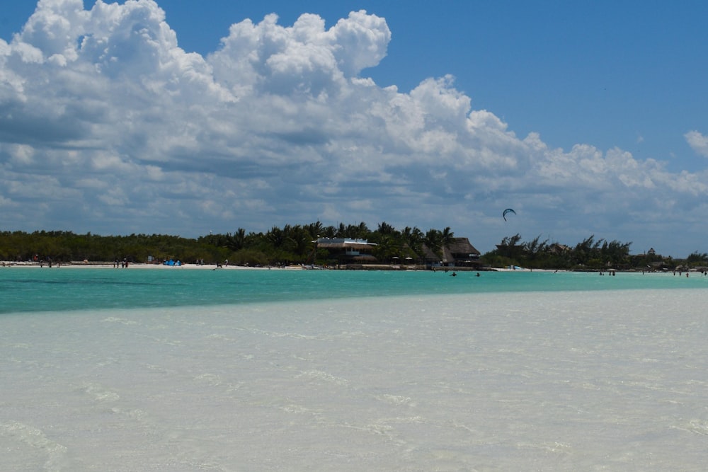 a white sandy beach with clear blue water