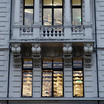 Front view of gooch & co. storefront with sneakers and jewelry displays visible through the windows.