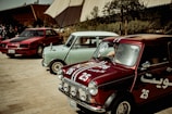 a row of old cars parked next to each other