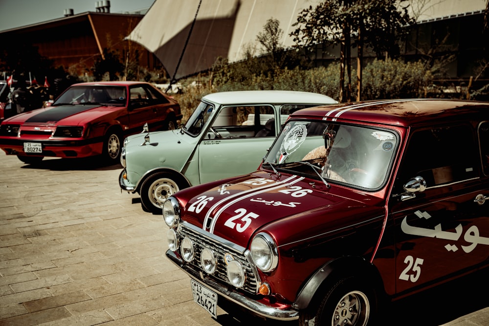 a row of old cars parked next to each other