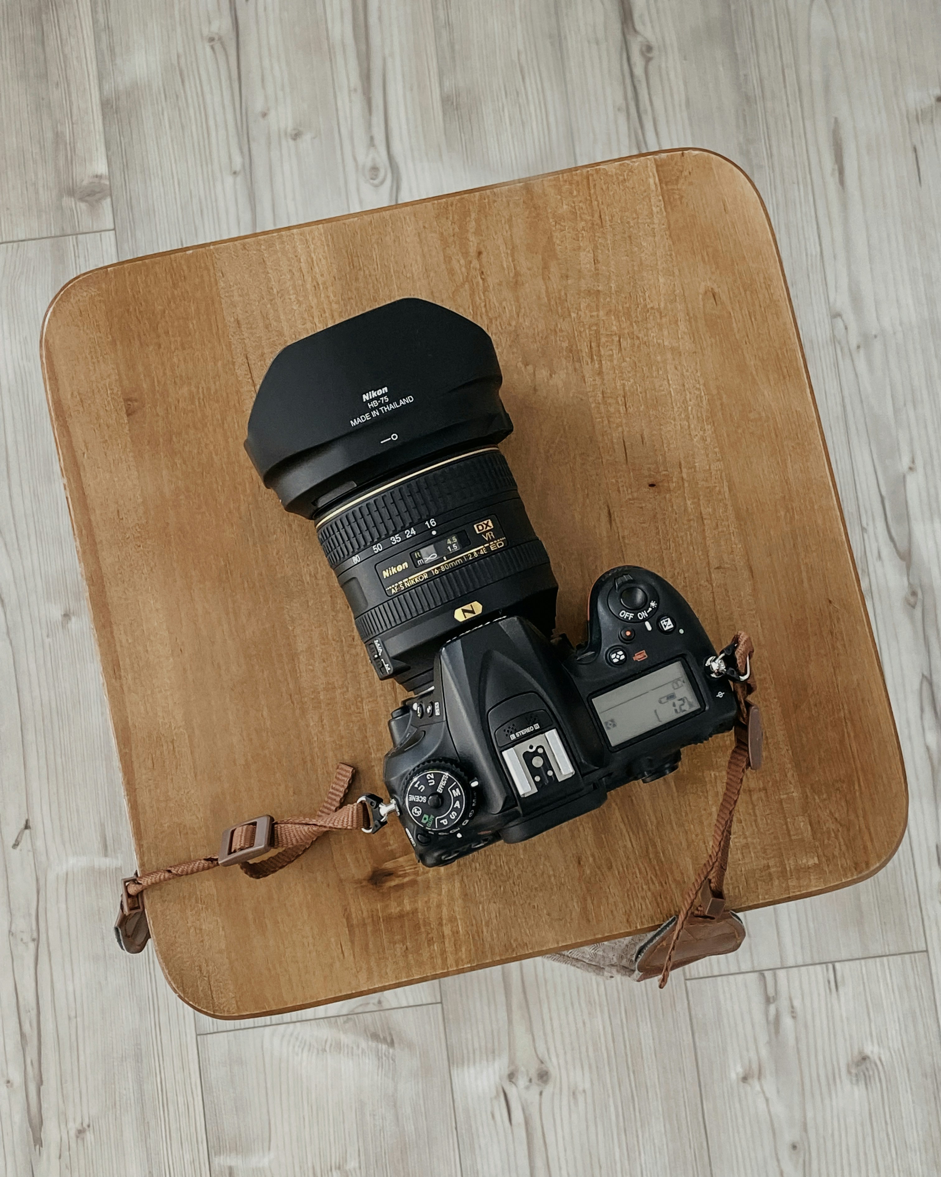 a camera sitting on top of a wooden table