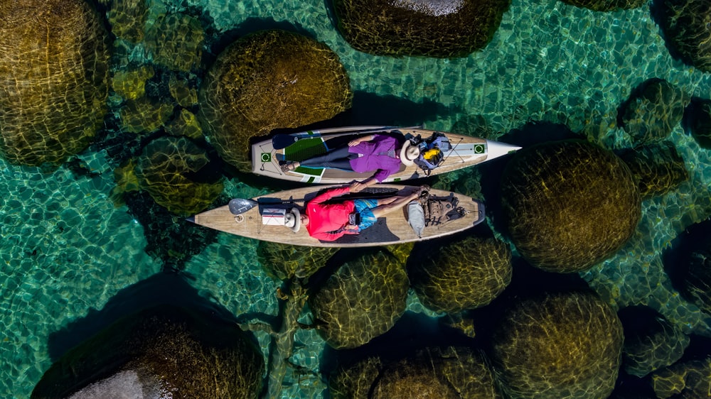 a couple of people in a boat on a body of water