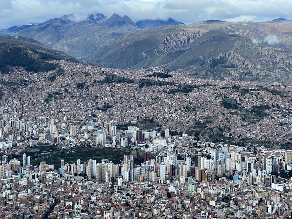 a view of a city with mountains in the background