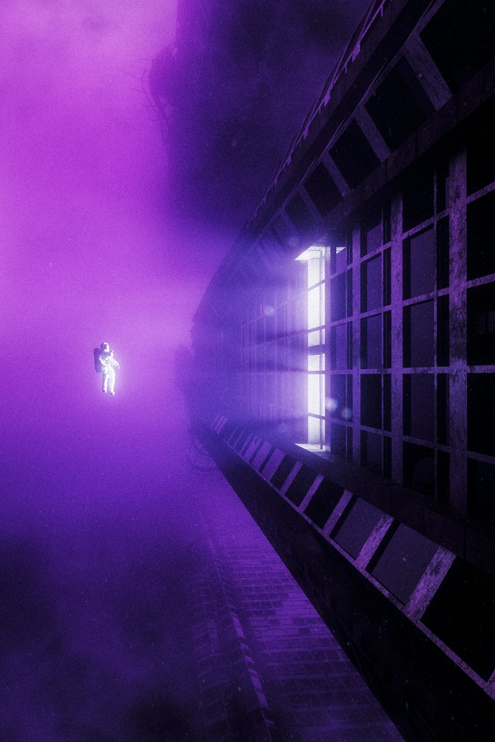 a person standing on a walkway in a foggy area