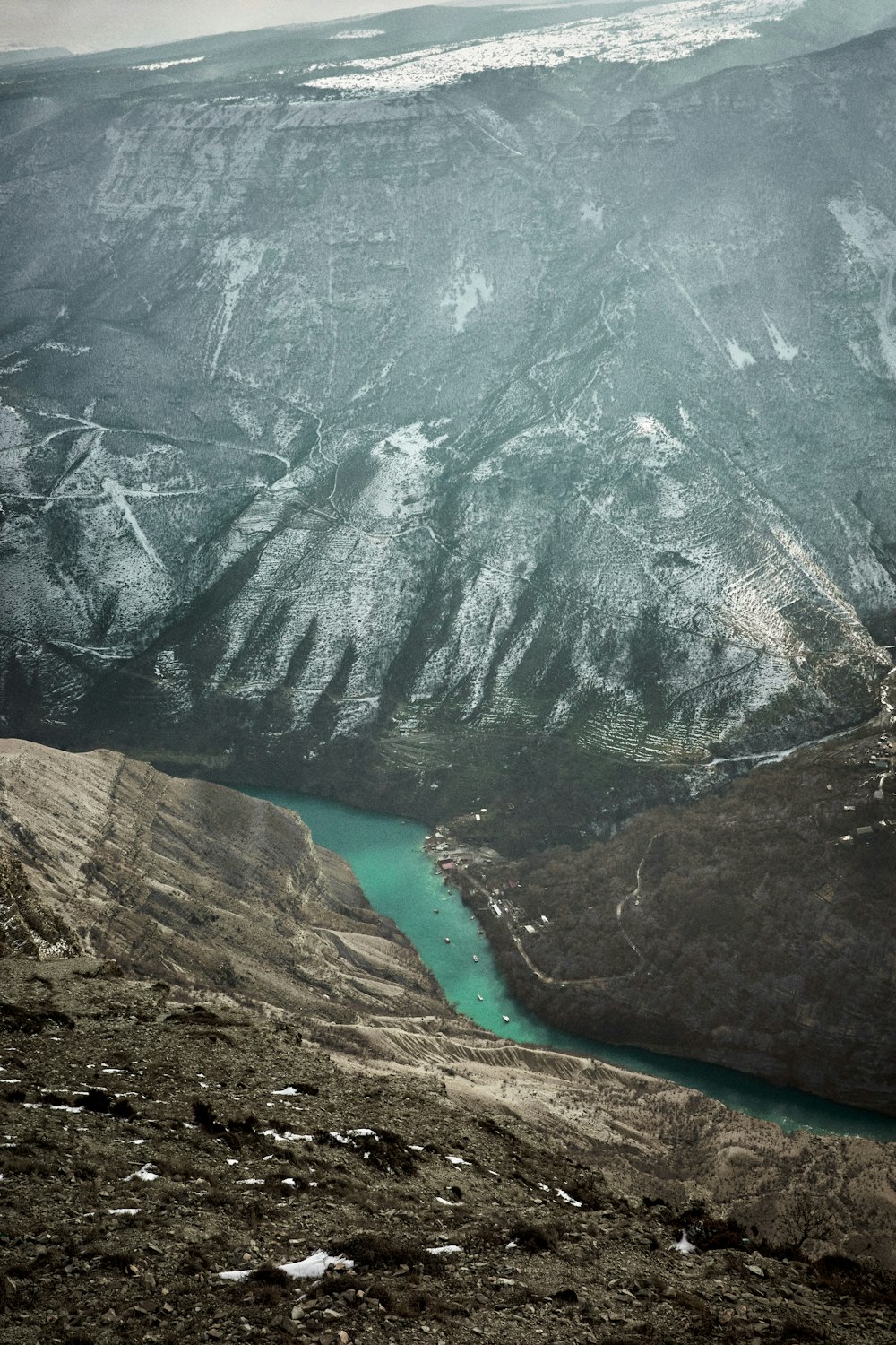 a view of a mountain with a lake in the middle of it