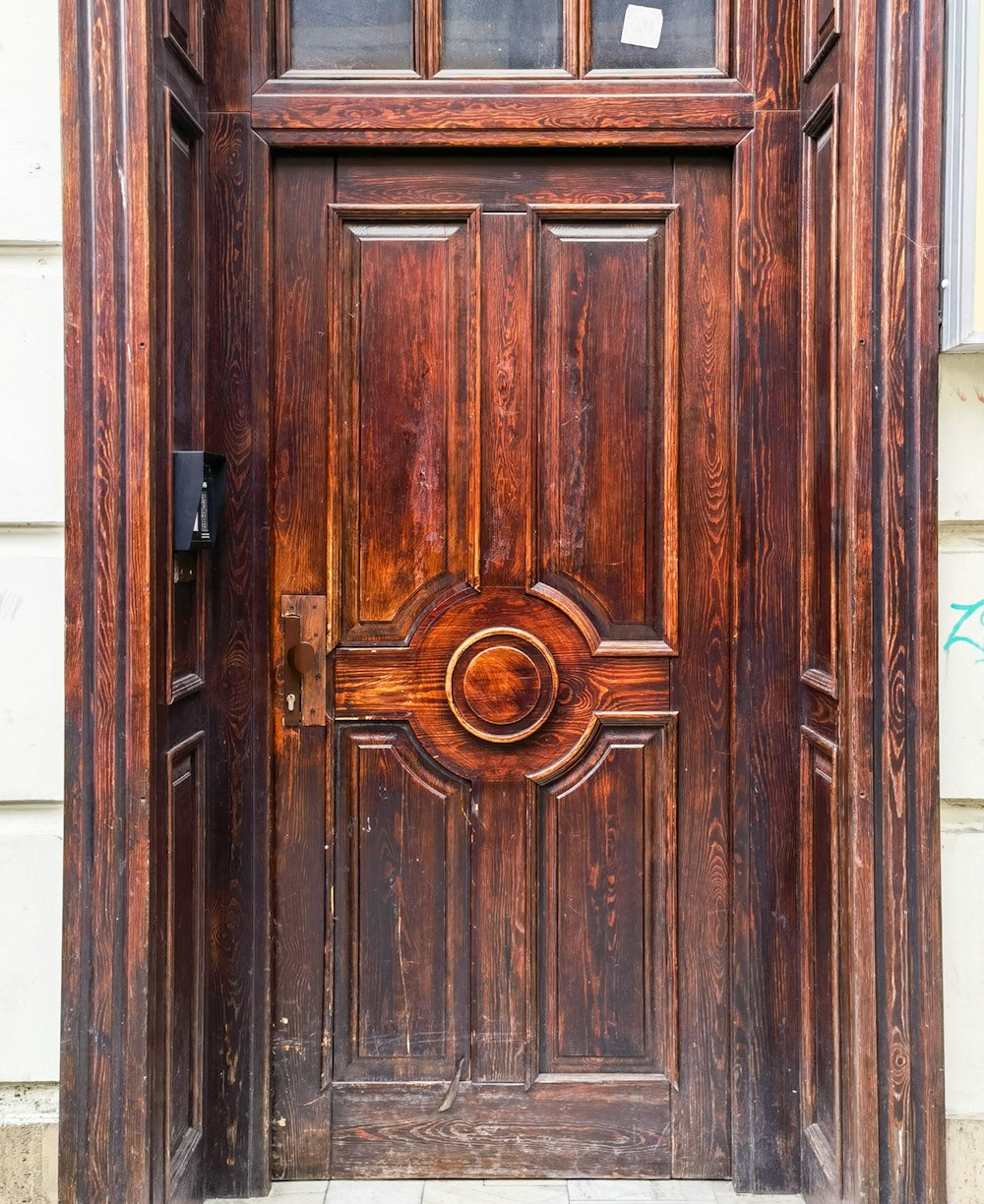 a close up of a wooden door on a building