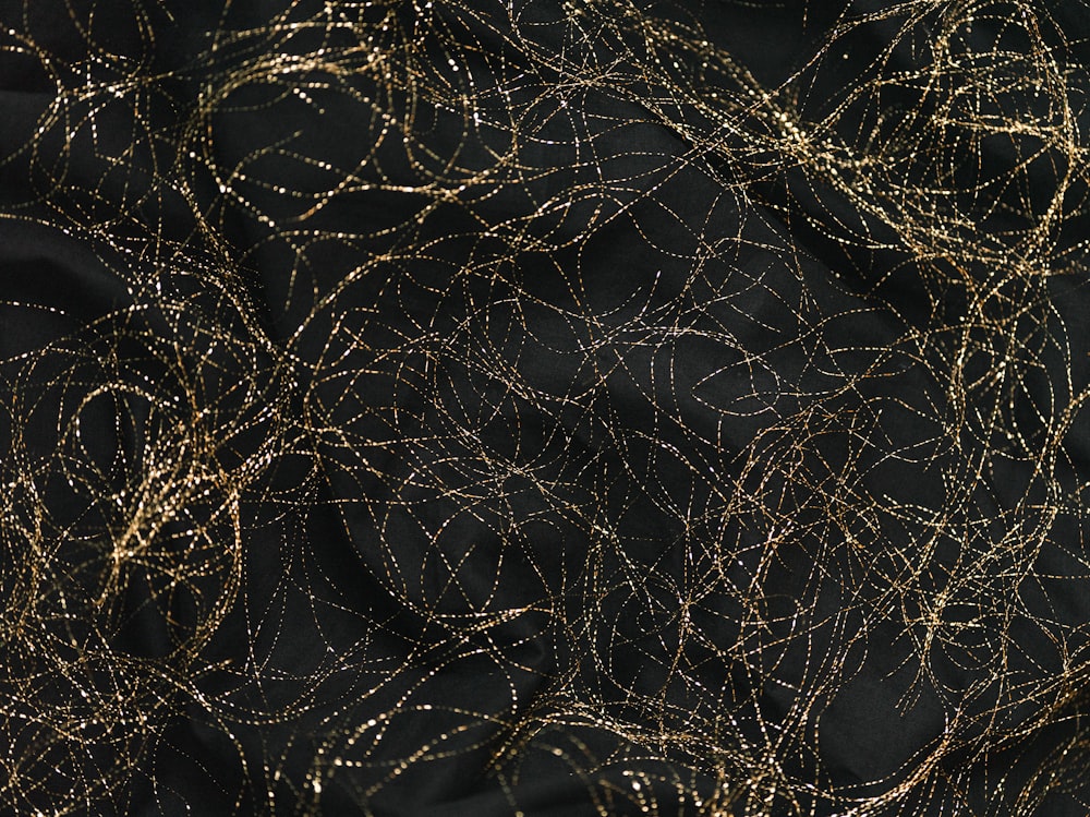 a black background with gold lines and dots