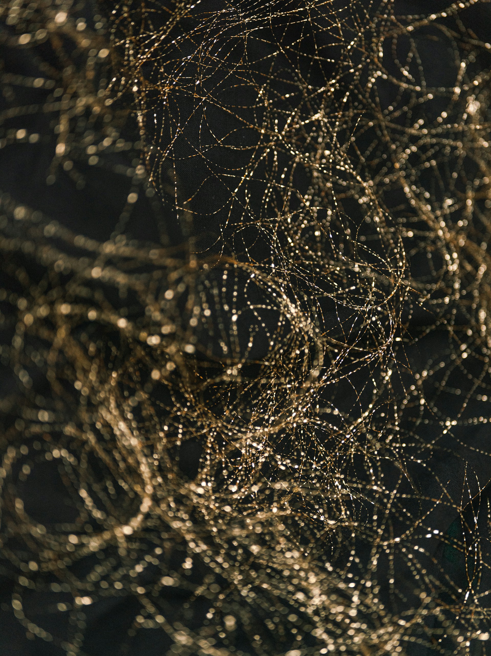 a close up of a cell phone with a bunch of wires on it