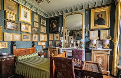 chateau rochefoucauld a room with a lot of pictures on the wall