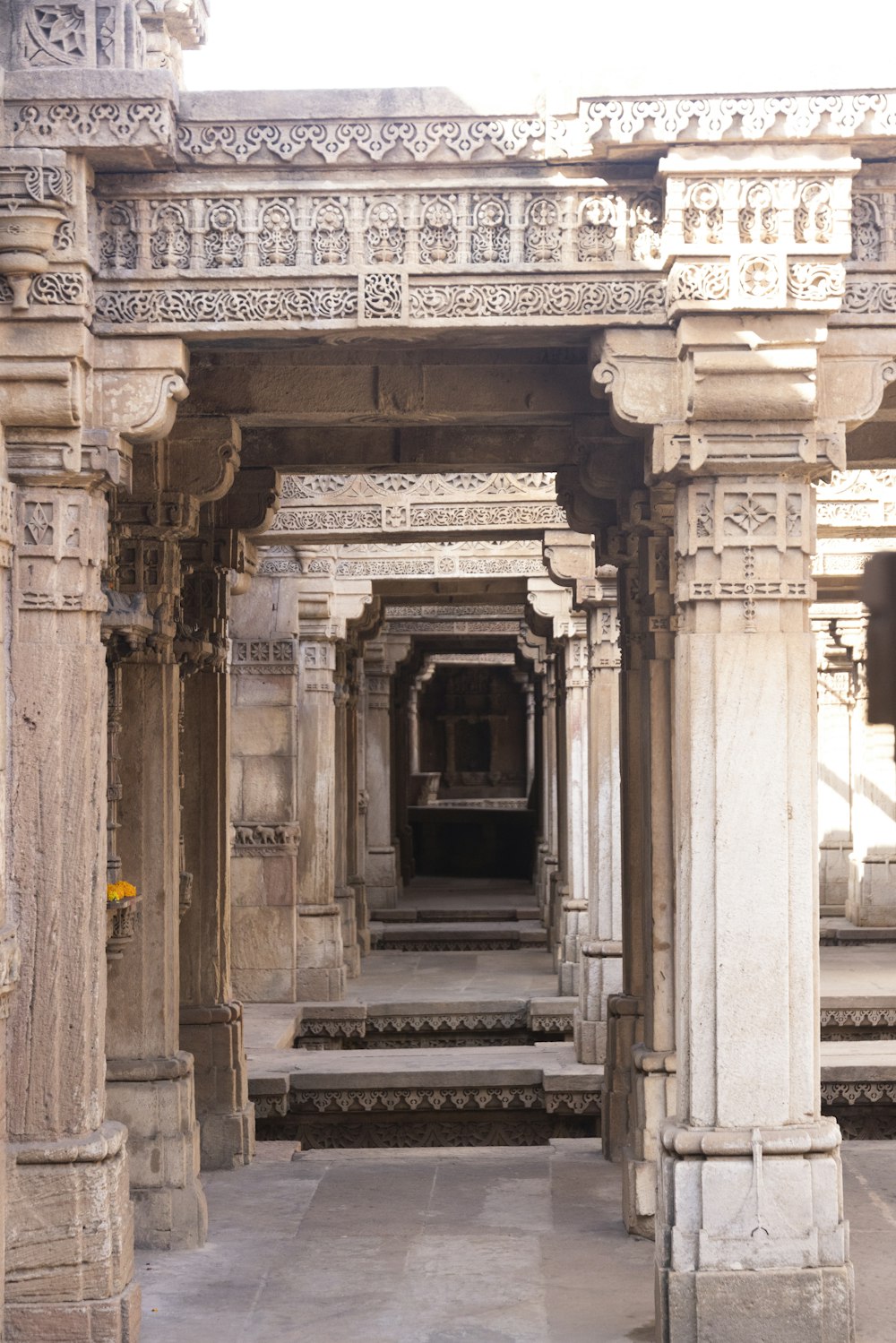 a stone structure with pillars and steps