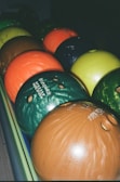 a bunch of bowling balls sitting on top of each other