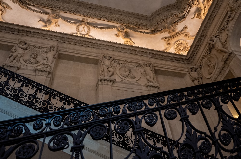 a stair case in a building with a decorative ceiling