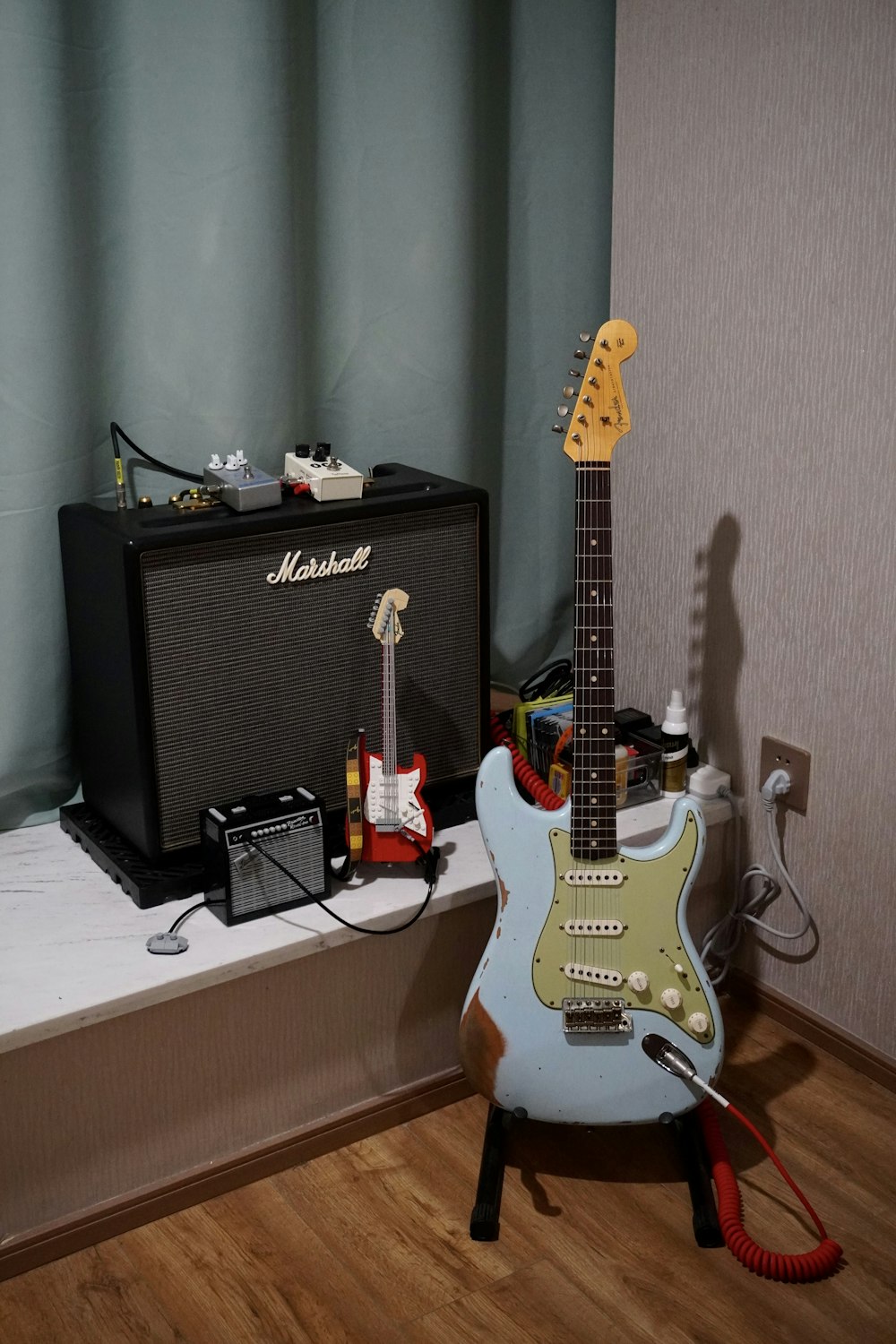 a guitar and amp sitting on a table