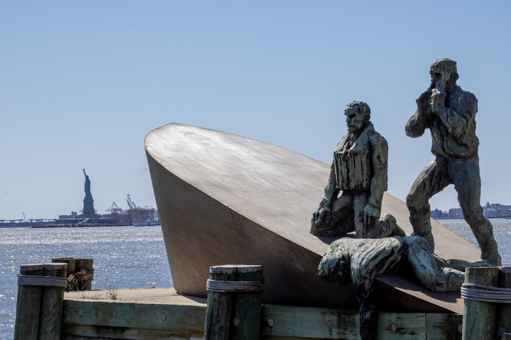 a statue of two men standing next to each other