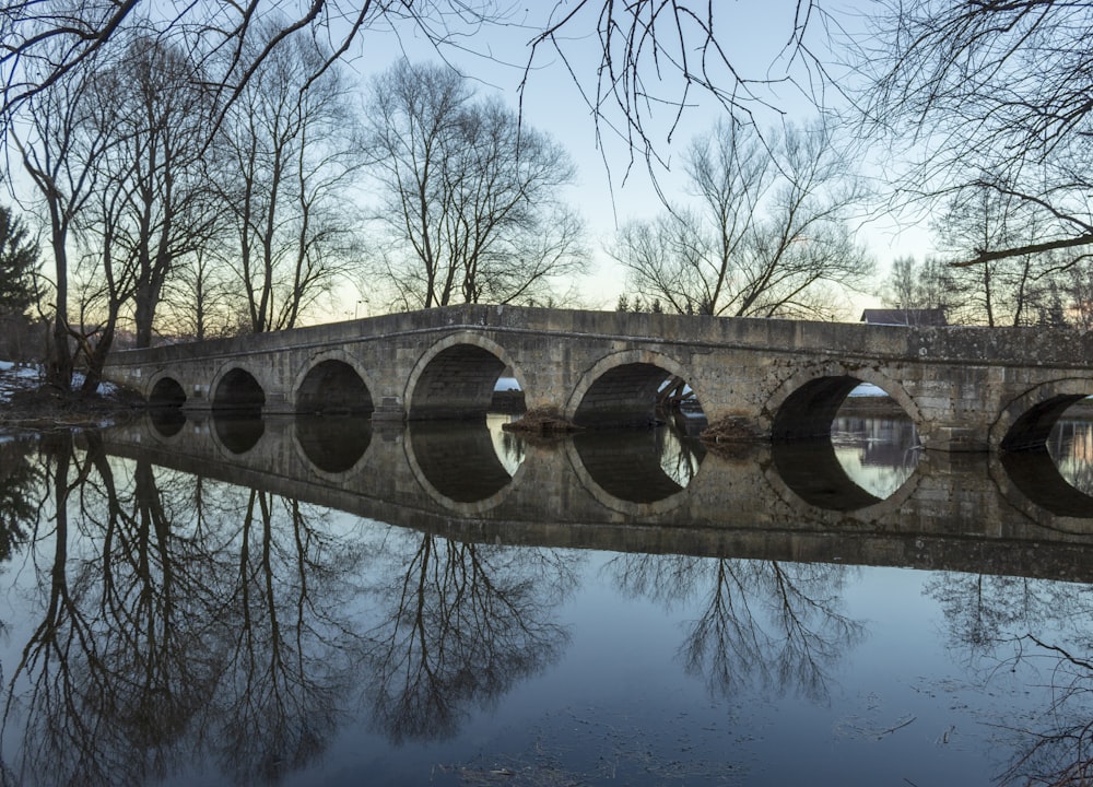 a stone bridge over a body of water